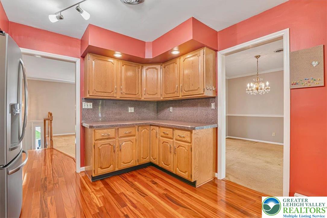 1210 Bluestone Drive Bethlehem, PA 18017 - Photo 23 of 84 a kitchen with granite countertop a refrigerator and wooden floor