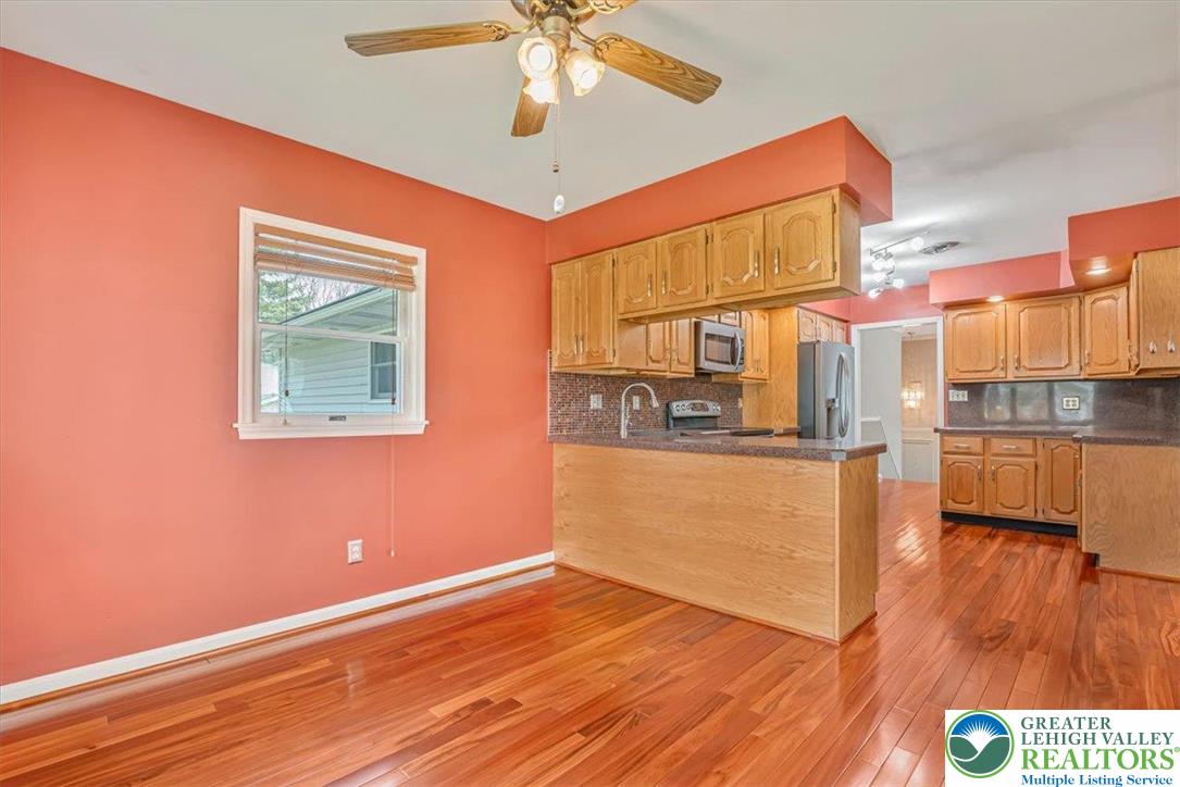 1210 Bluestone Drive Bethlehem, PA 18017 - Photo 24 of 84 a view of a room with wooden floor and a ceiling fan