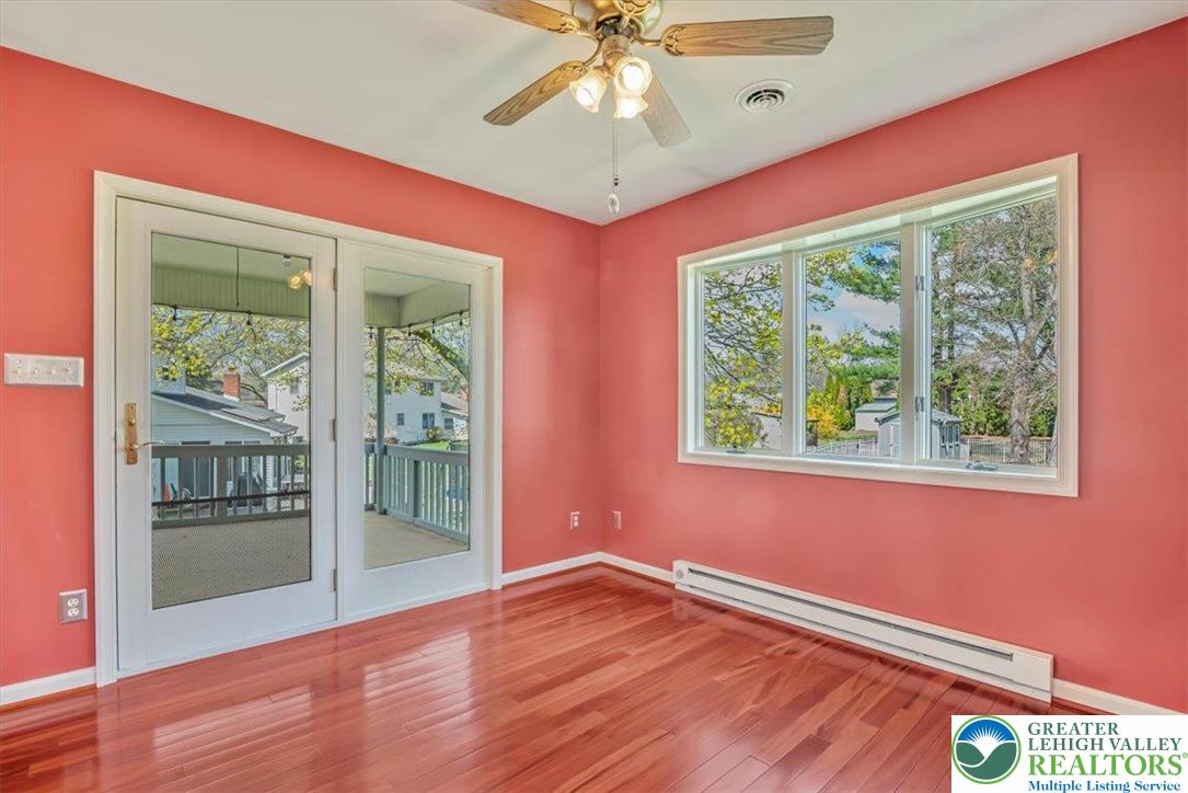 1210 Bluestone Drive Bethlehem, PA 18017 - Photo 26 of 84 a view of an empty room with wooden floor and a window
