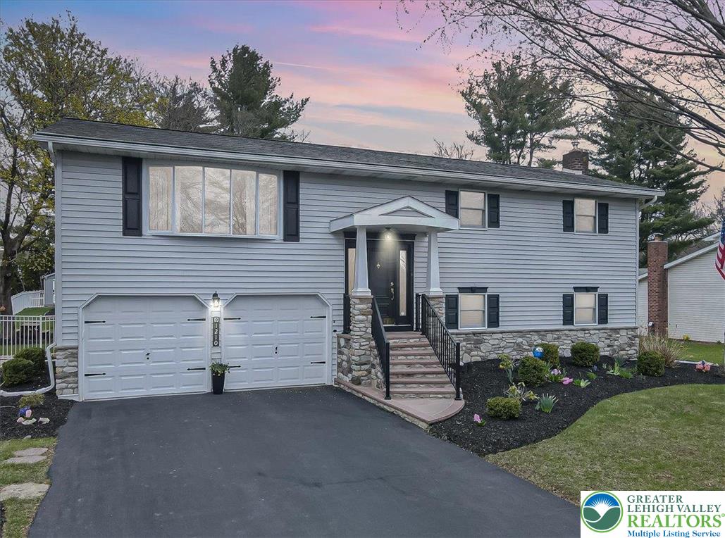 1210 Bluestone Drive Bethlehem, PA 18017 - Photo 3 of 84 a front view of a house with a garden