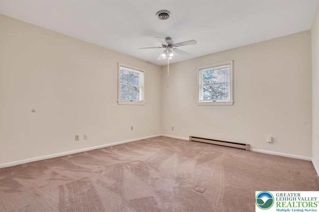 1210 Bluestone Drive Bethlehem, PA 18017 - Photo 31 of 84 an empty room with a window and ceiling fan