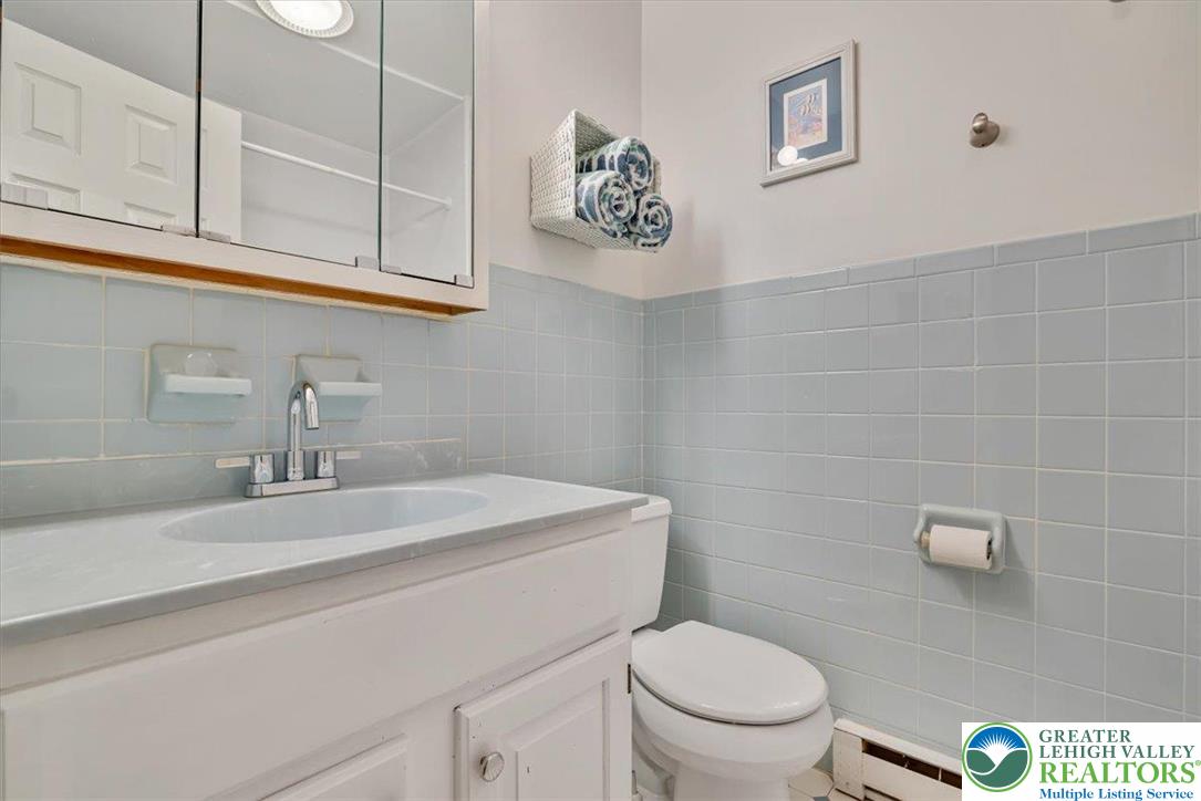 1210 Bluestone Drive Bethlehem, PA 18017 - Photo 33 of 84 a bathroom with a sink a toilet and mirror