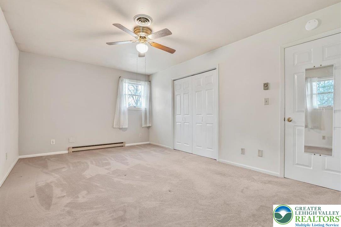 1210 Bluestone Drive Bethlehem, PA 18017 - Photo 37 of 84 an empty room with closet and a chandelier fan