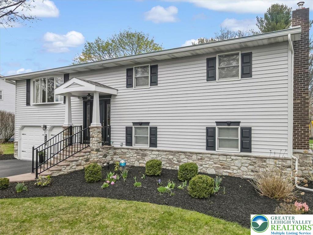 1210 Bluestone Drive Bethlehem, PA 18017 - Photo 5 of 84 a front view of a house with garden