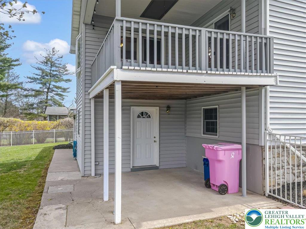 1210 Bluestone Drive Bethlehem, PA 18017 - Photo 76 of 84 a view of a house with a small yard and wooden fence