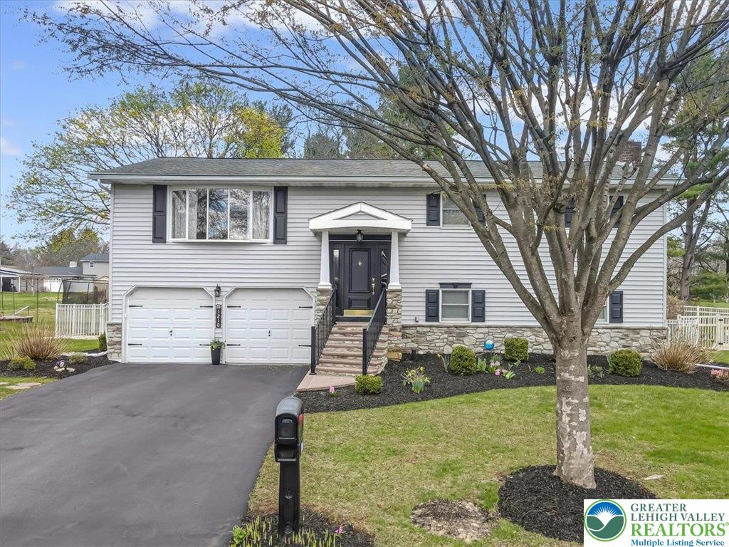 1210 Bluestone Drive Bethlehem, PA 18017 - Photo 83 of 84 front view of a house with a yard