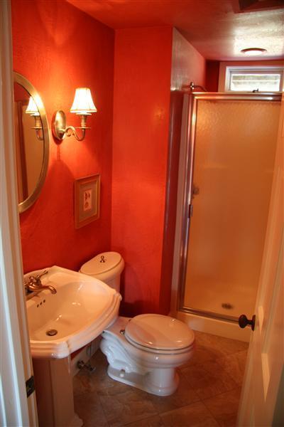 7 Miller Hill Road Provincetown, MA 02657 - Photo 14 of 30 a white toilet sitting next to a bathroom sink