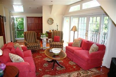 7 Miller Hill Road Provincetown, MA 02657 - Photo 16 of 30 a living room with furniture and a large window