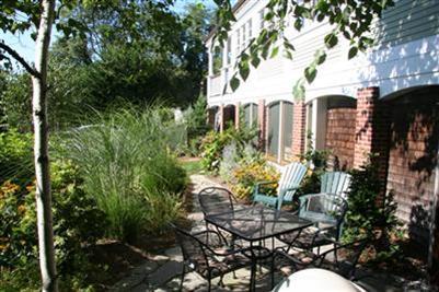 7 Miller Hill Road Provincetown, MA 02657 - Photo 21 of 30 a view of a chairs and table in backyard