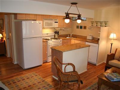 7 Miller Hill Road Provincetown, MA 02657 - Photo 24 of 30 a kitchen with stainless steel appliances granite countertop a sink a refrigerator and a stove
