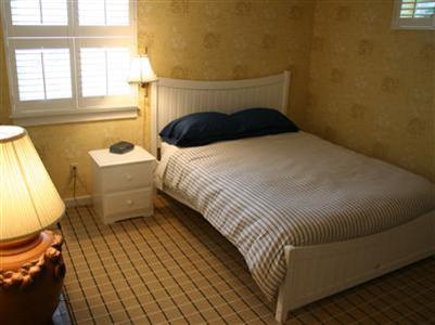 7 Miller Hill Road Provincetown, MA 02657 - Photo 29 of 30 a bedroom with a bed and a window