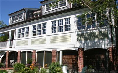 7 Miller Hill Road Provincetown, MA 02657 - Photo 3 of 30 a large building with a lot of windows
