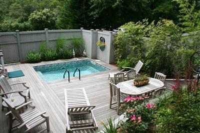 7 Miller Hill Road Provincetown, MA 02657 - Photo 4 of 30 a view of a backyard with plants and outdoor seating