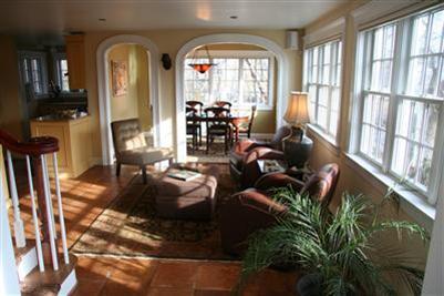 7 Miller Hill Road Provincetown, MA 02657 - Photo 7 of 30 a living room with patio furniture and floor to ceiling windows
