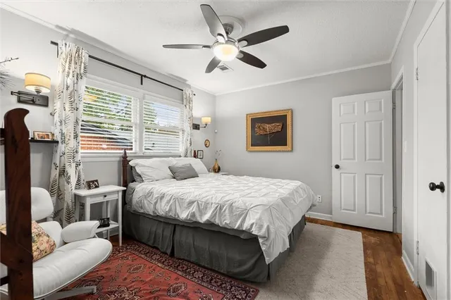 a bedroom with a bed couch and window