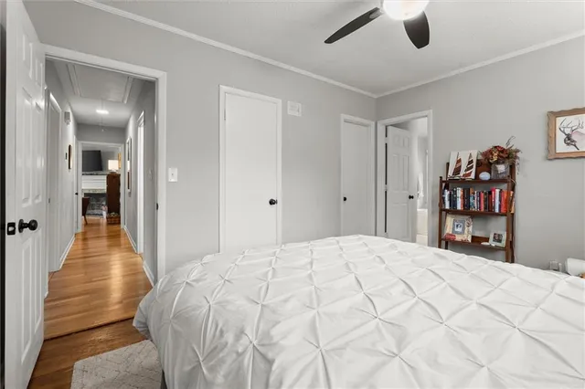 a bedroom with a bed and a book shelf