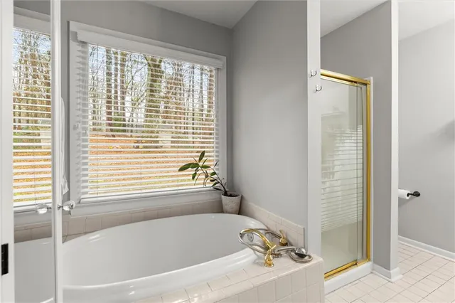 a white bath tub sitting next to a window