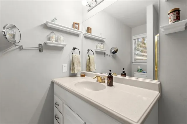 a bathroom with a sink and a mirror