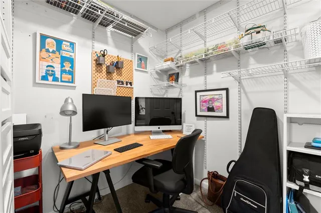 a view of a workspace with furniture