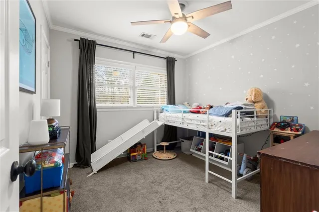 a bed room with furniture and a window