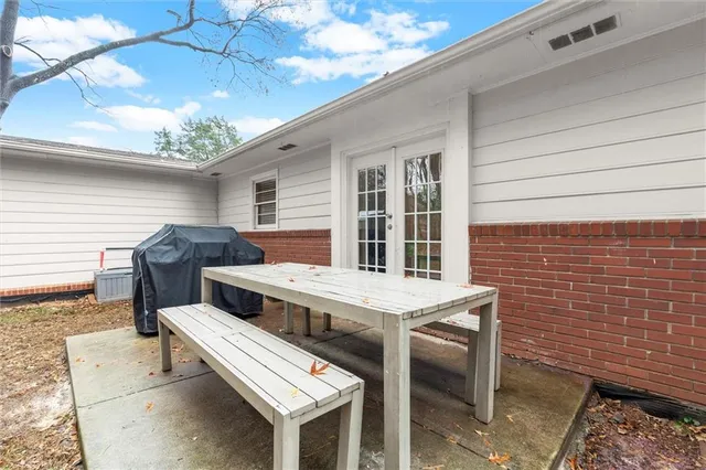 a view of a street with cars parked on the road