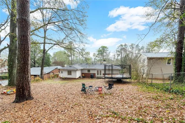 a house view with a backyard space