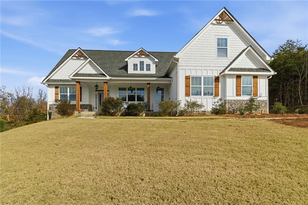 760 Stoneledge Road Jasper, GA 30143 - Photo 1 of 68 a front view of a house with garden