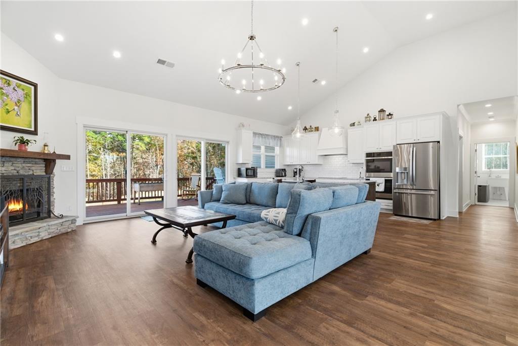 760 Stoneledge Road Jasper, GA 30143 - Photo 11 of 68 a living room with furniture and a fireplace