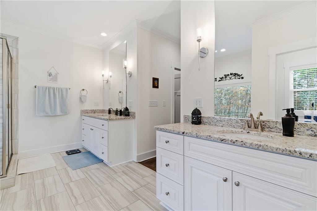 760 Stoneledge Road Jasper, GA 30143 - Photo 19 of 68 a spacious bathroom with a granite countertop sink mirror and