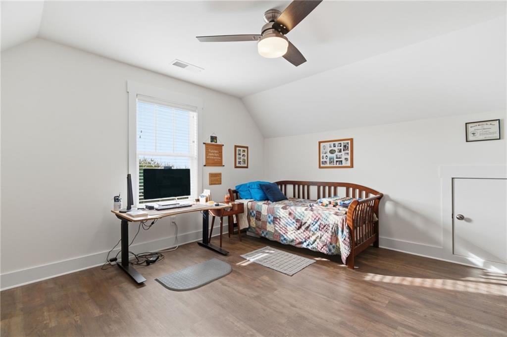 760 Stoneledge Road Jasper, GA 30143 - Photo 26 of 68 a bedroom with a bed and a chair