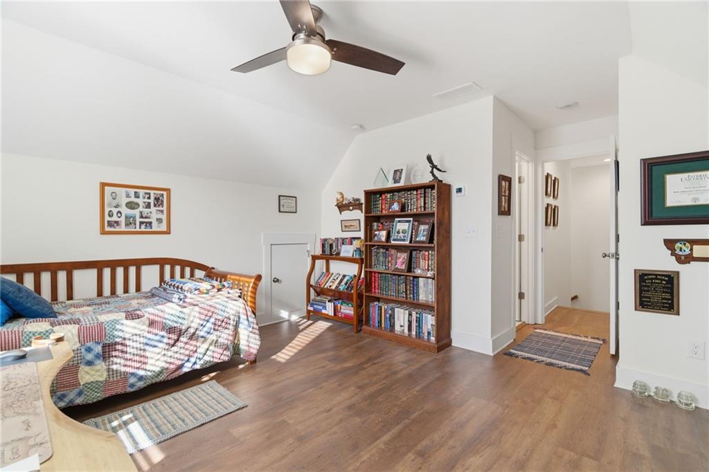 760 Stoneledge Road Jasper, GA 30143 - Photo 27 of 68 a living room with furniture and a wooden floor
