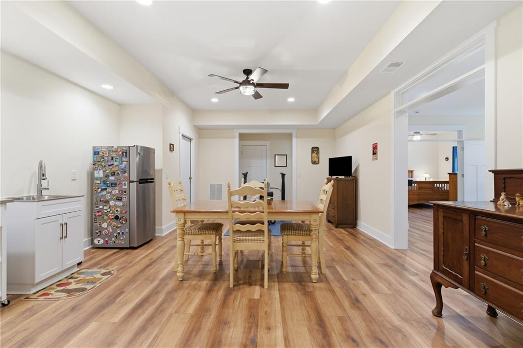760 Stoneledge Road Jasper, GA 30143 - Photo 33 of 68 a dining room with furniture and wooden floor