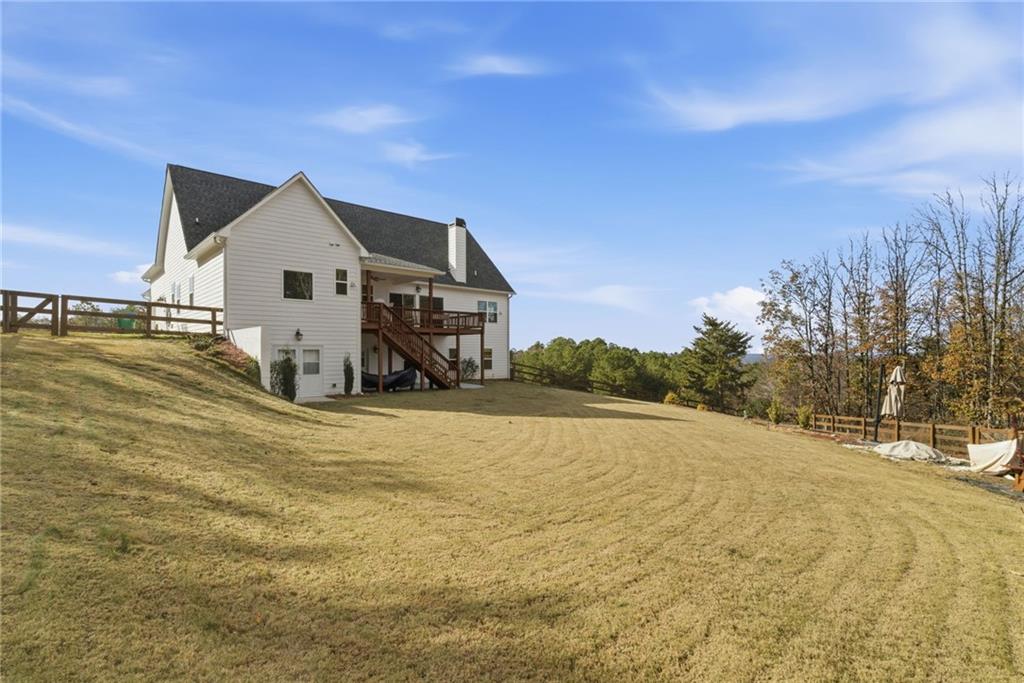 760 Stoneledge Road Jasper, GA 30143 - Photo 46 of 68 a view of a house with a yard