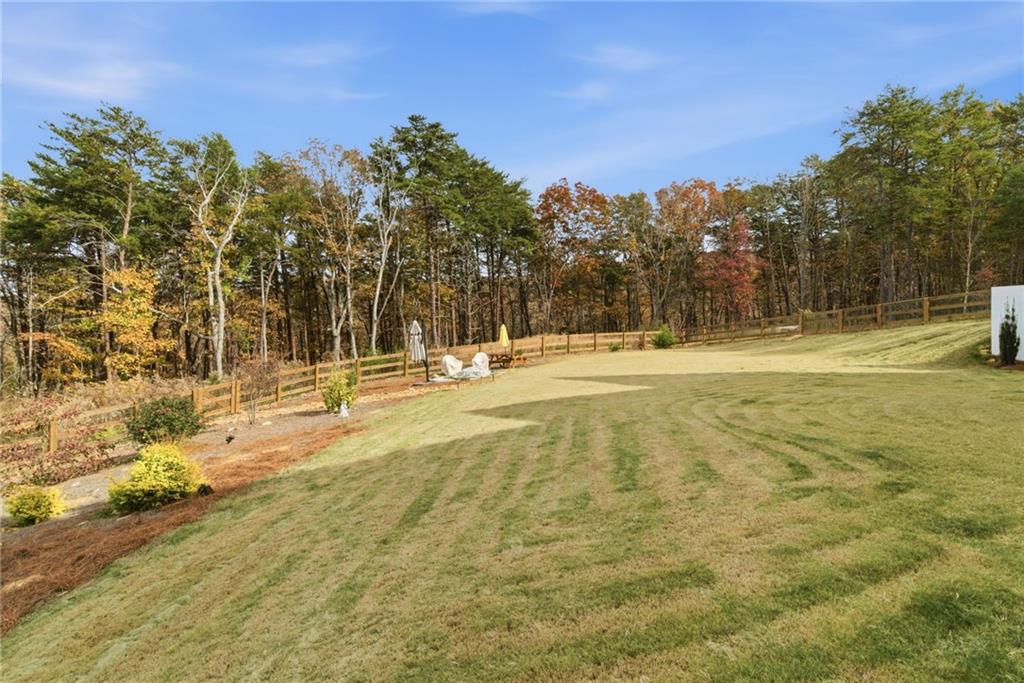 760 Stoneledge Road Jasper, GA 30143 - Photo 49 of 68 a view of a yard with swimming pool and trees