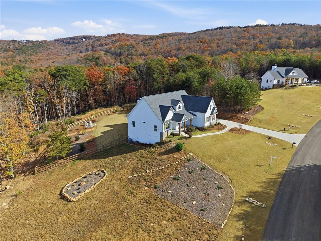 760 Stoneledge Road Jasper, GA 30143 - Photo 64 of 68 an aerial view of a house with a yard and mountain view in back