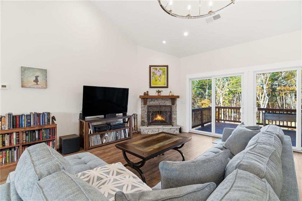 760 Stoneledge Road Jasper, GA 30143 - Photo 9 of 68 a living room with furniture and a flat screen tv