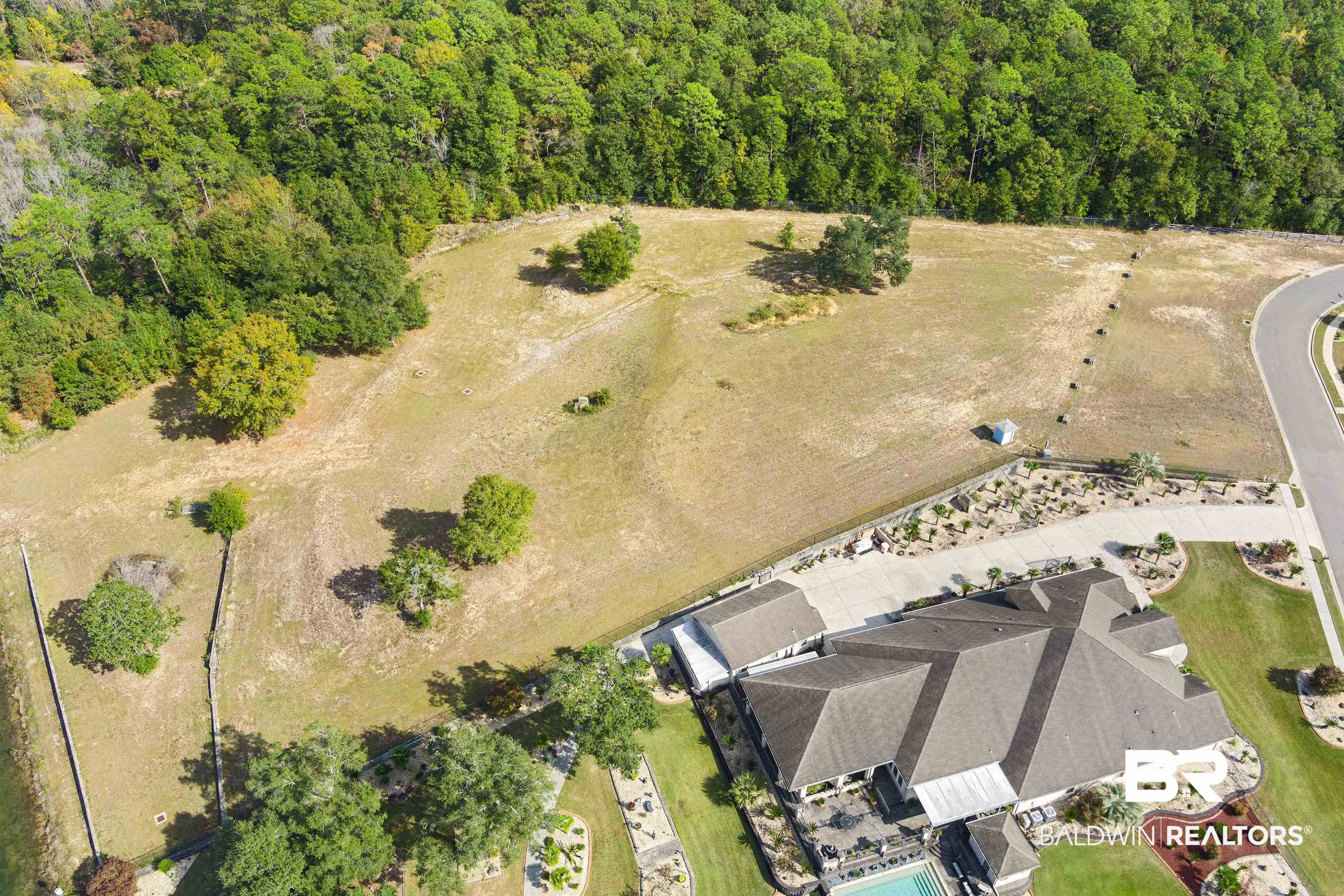 8512 Crepe Myrtle Court Mobile, AL 36619 - Photo 8 of 10 Aerial view of property and surrounding area with a heavily wooded area