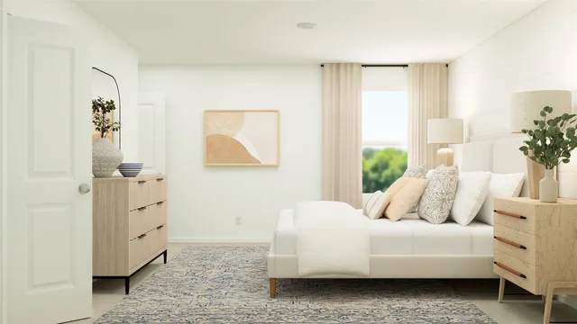 a bedroom with a bed and a dresser