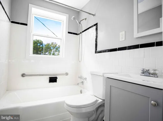 a bathroom with a sink a toilet and a bathtub