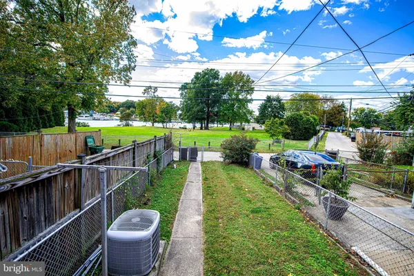 a view of a balcony with yard