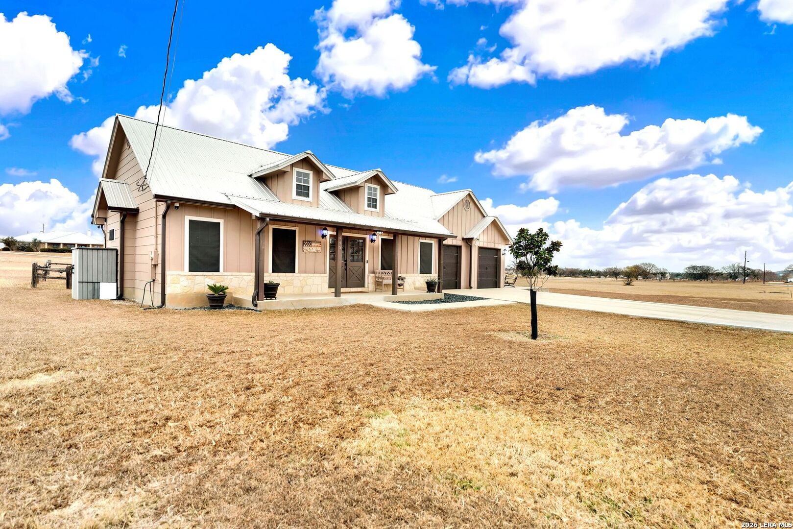 445 Spanish Grant Circle Bandera, TX 78003 - Photo 13 of 47 a front view of a house with a yard
