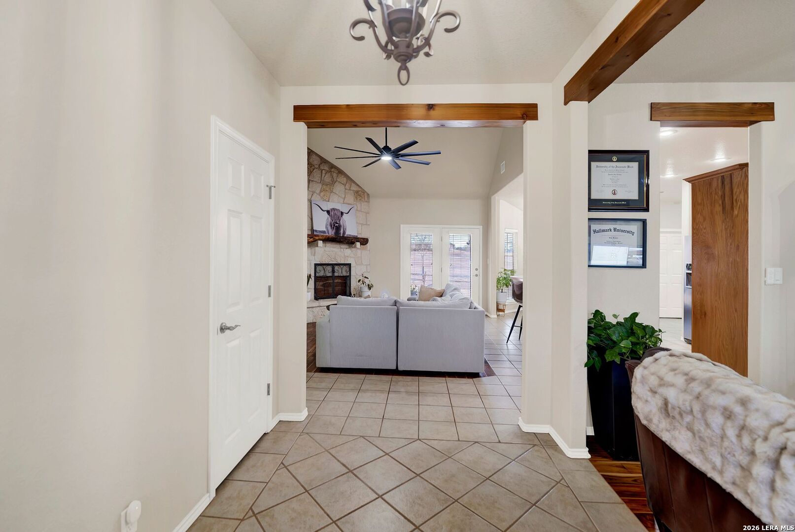 445 Spanish Grant Circle Bandera, TX 78003 - Photo 18 of 47 a living room with furniture and a chandelier