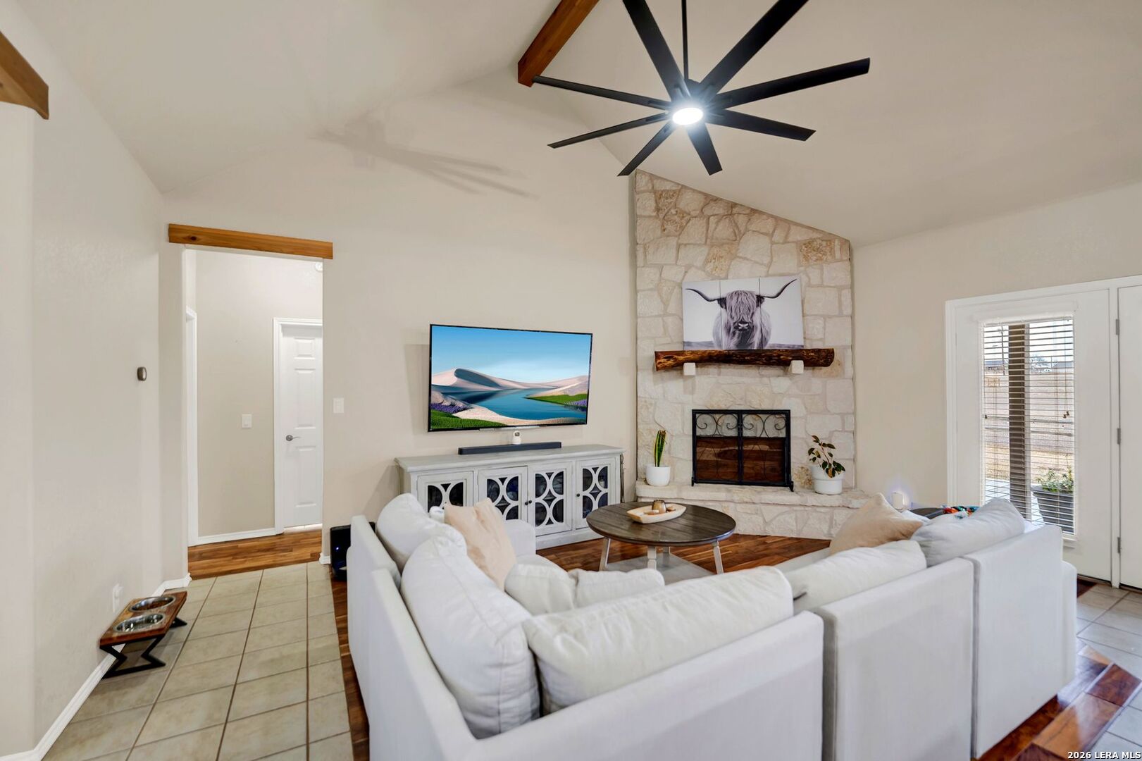 445 Spanish Grant Circle Bandera, TX 78003 - Photo 21 of 47 a living room with furniture and a fireplace