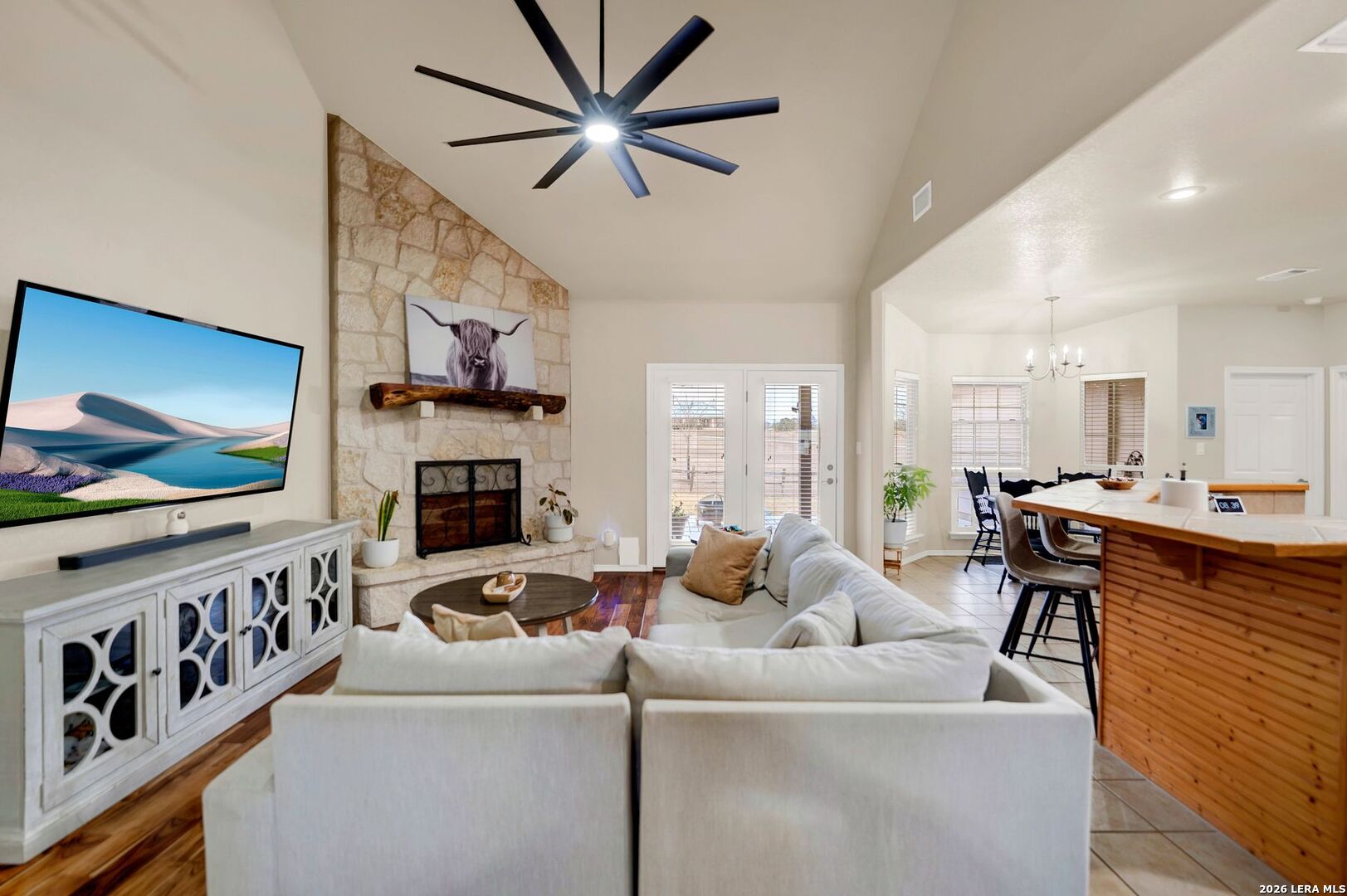 445 Spanish Grant Circle Bandera, TX 78003 - Photo 22 of 47 a living room with furniture and a flat screen tv