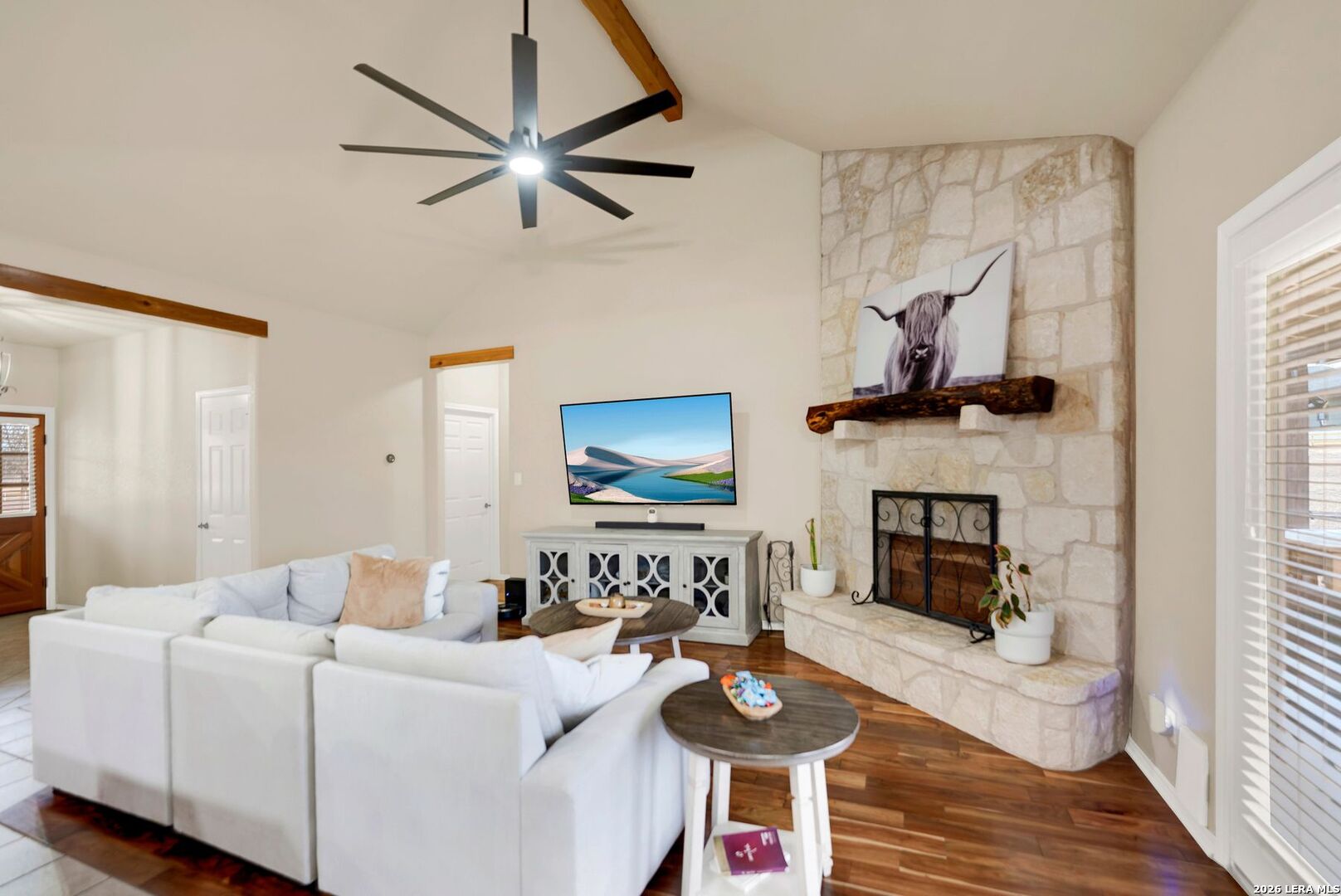 445 Spanish Grant Circle Bandera, TX 78003 - Photo 24 of 47 a living room with furniture and a fireplace