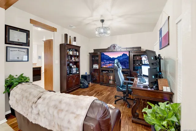 a bed room with a bed and a gym