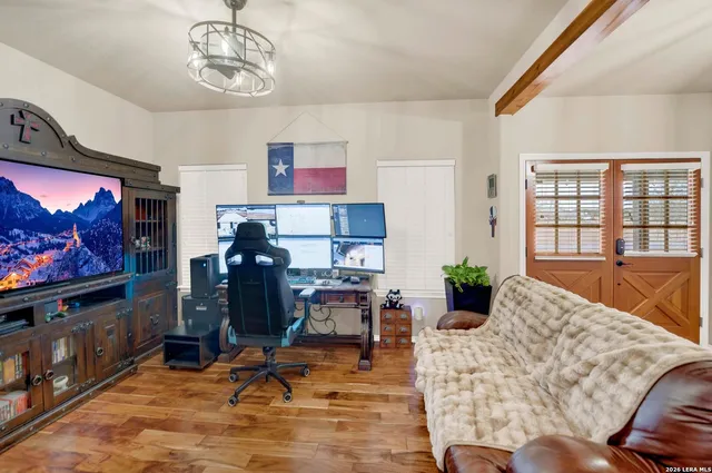 a living room with furniture and a flat screen tv