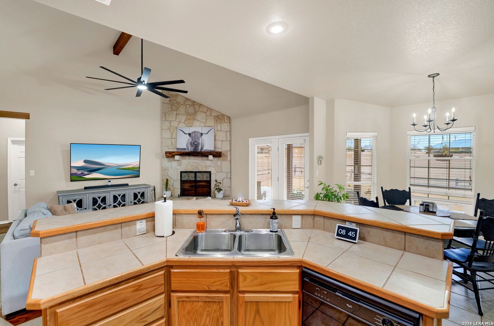 445 Spanish Grant Circle Bandera, TX 78003 - Photo 28 of 47 a kitchen with a counter space a sink and appliances