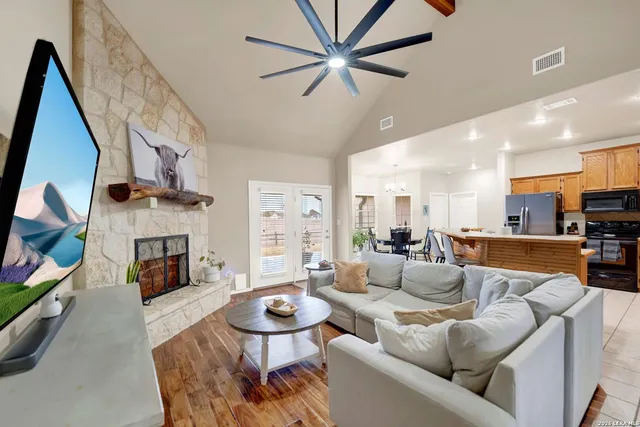 a living room with furniture fireplace and a flat screen tv
