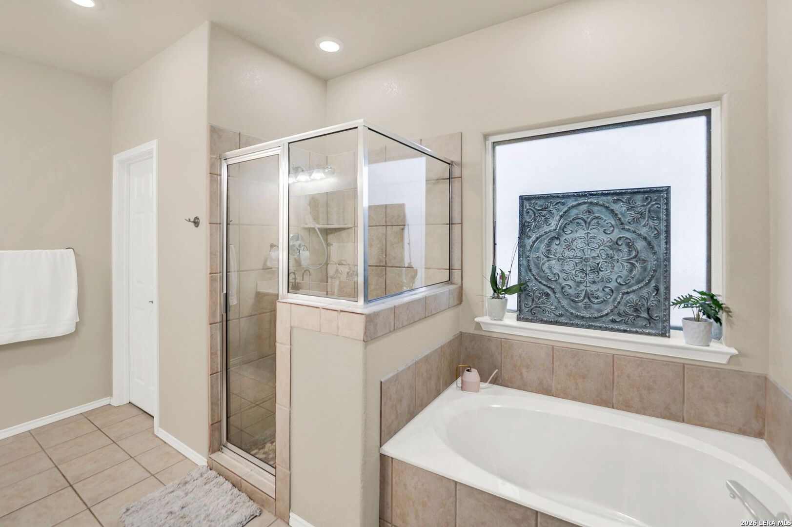 445 Spanish Grant Circle Bandera, TX 78003 - Photo 33 of 47 a bathroom with a bathtub and a shower